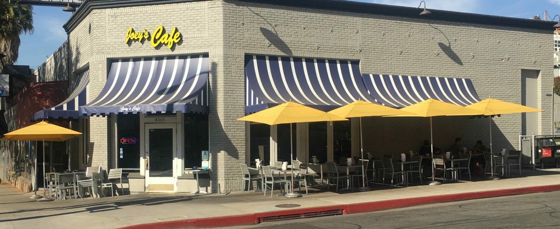 Striped awnings over restaurant patio