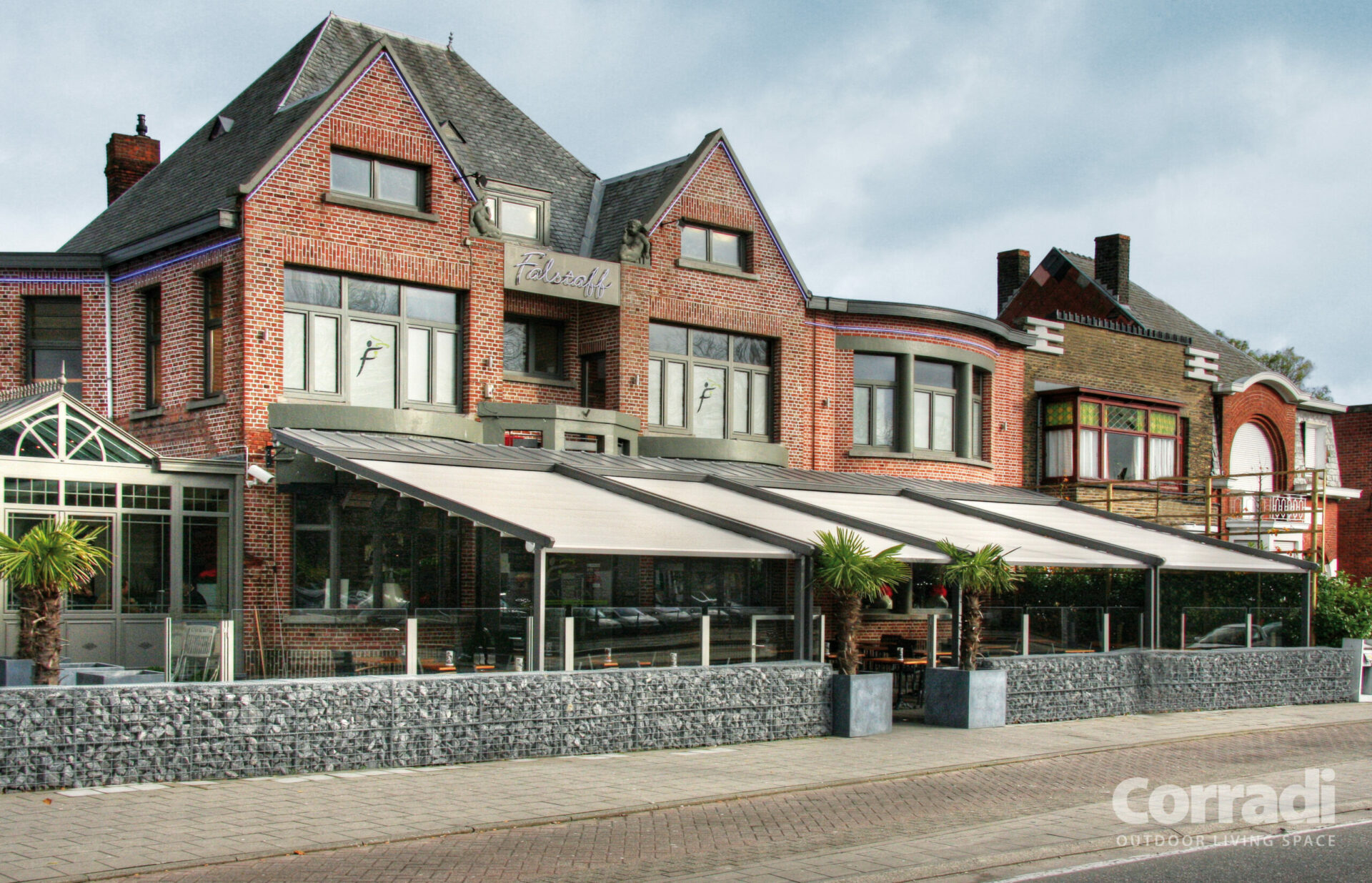 Retractable awning over hotel patio