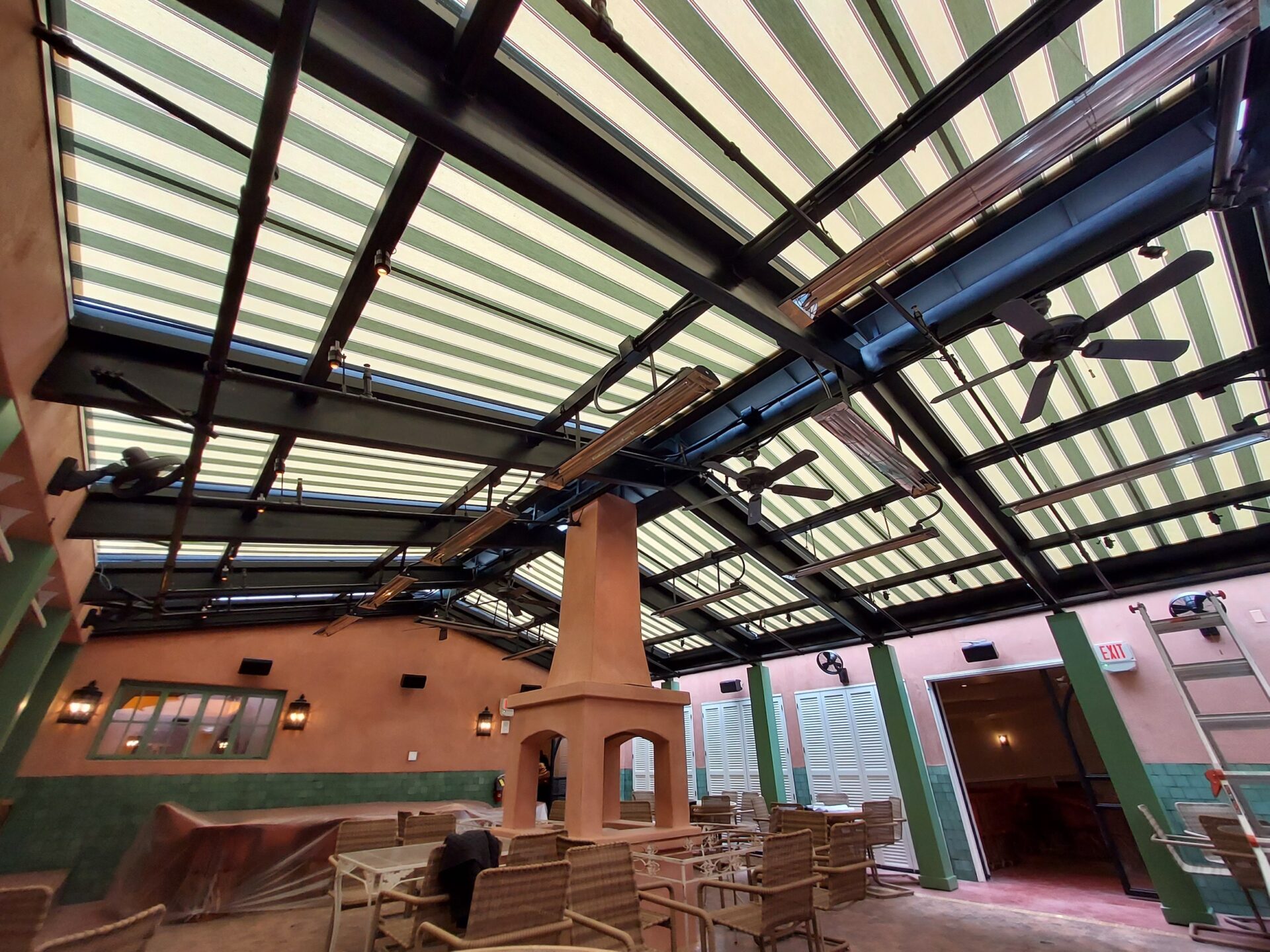 Indoor restaurant patio with retractable awning