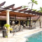 Striped slide on wire awning over a patio