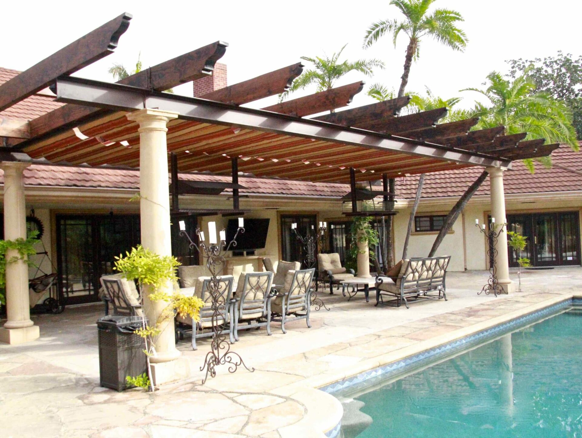 Striped slide on wire awning over a patio