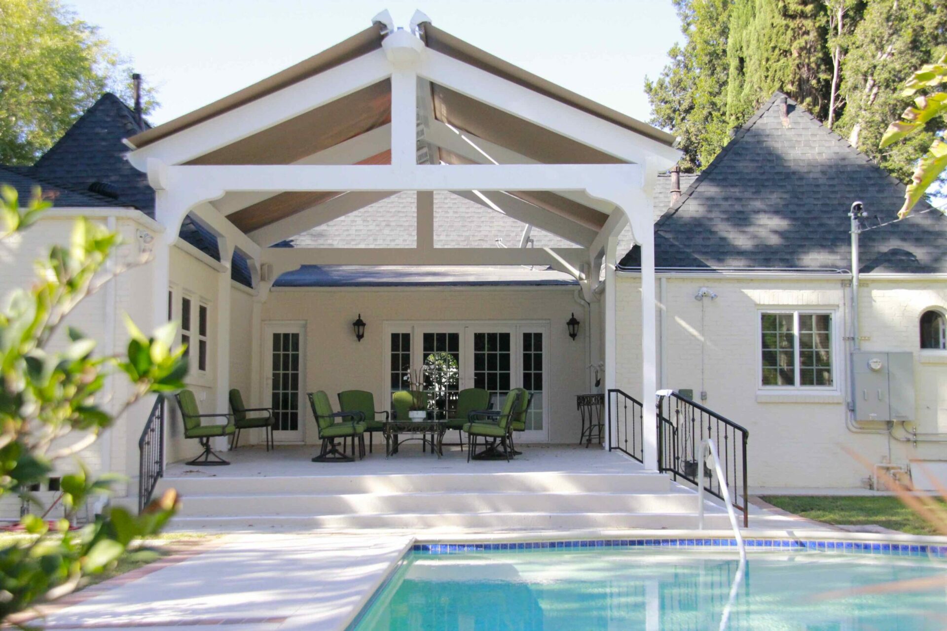 Retractable Skylight awnings over a backyard pool