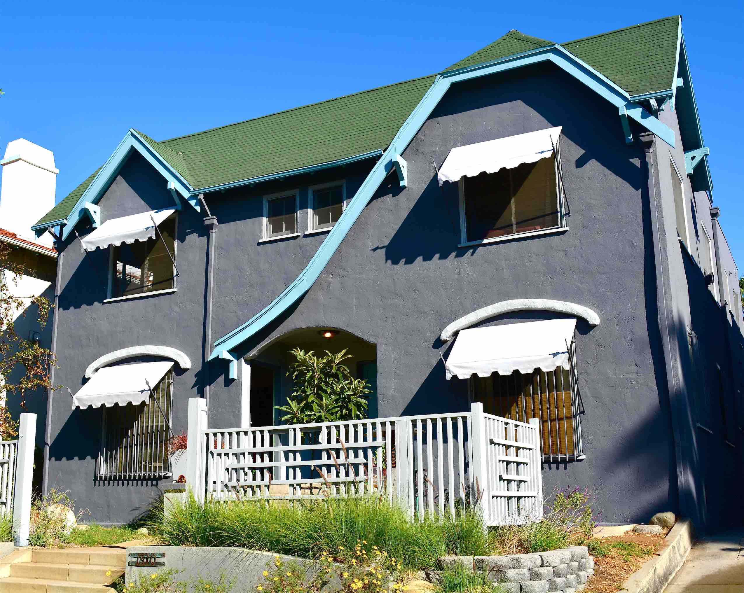 White spear awnings over front windows